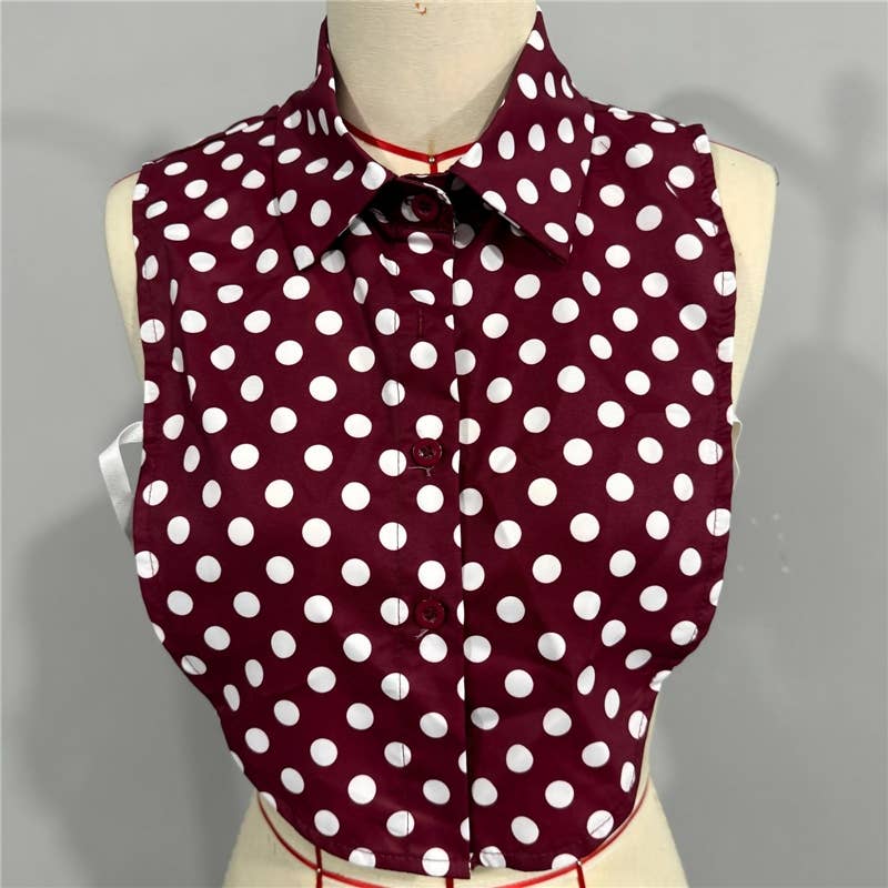 Polka dot shirt on a mannequin with a gray background