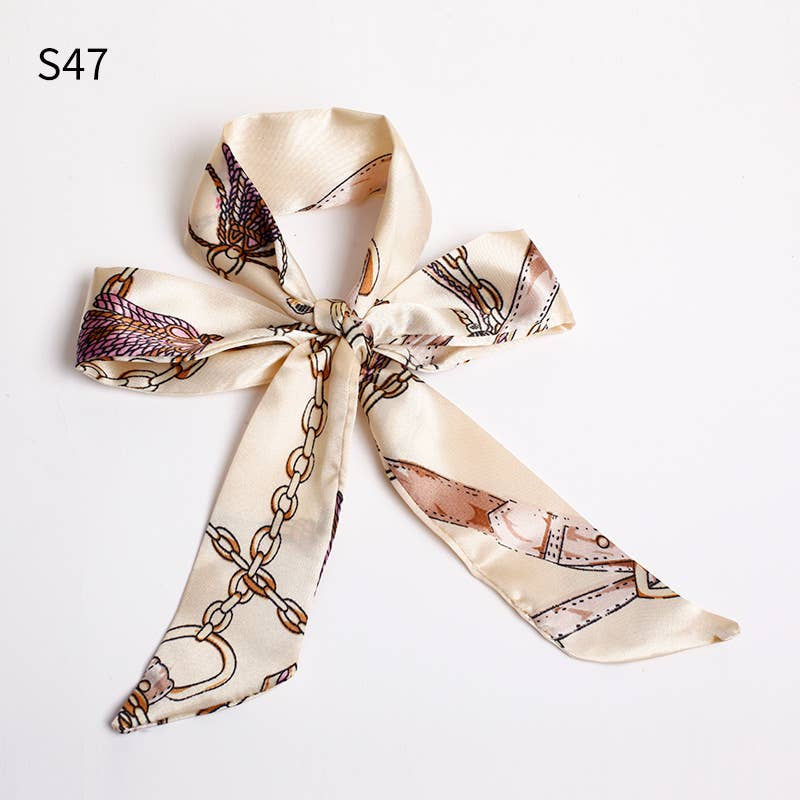 Beige scarf with chain and bird pattern on a white background