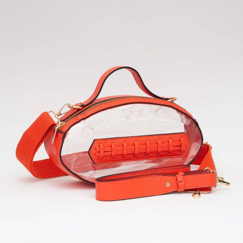 Orange crossbody bag with clear section on a light gray background