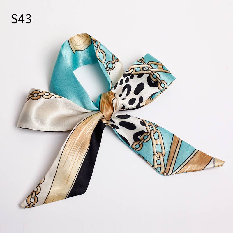 Colorful bow-shaped hair accessory with patterned design on a white background