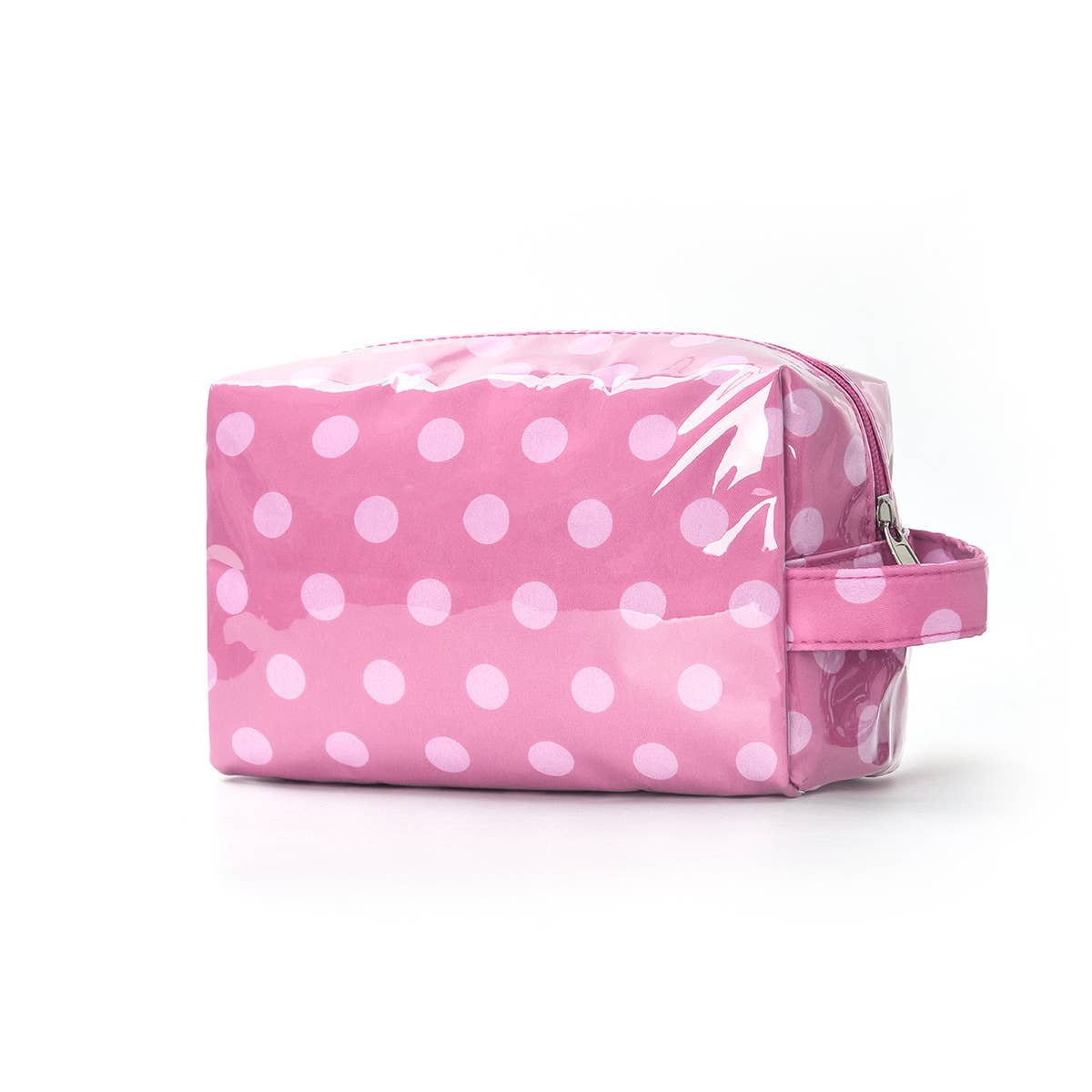 Pink polka dot toiletry bag on a white background