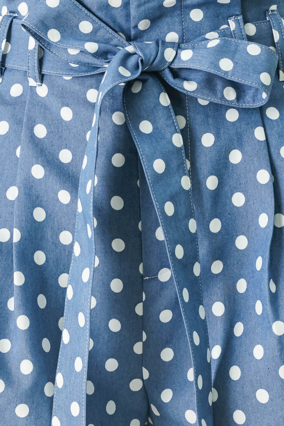 Blue dress with white polka dots and a tie waist