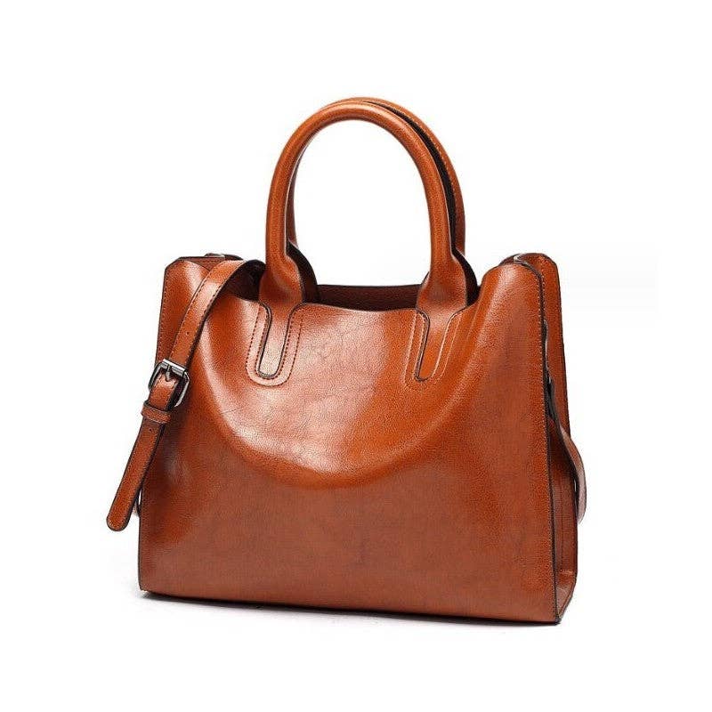 A medium brown faux-leather handbag with dual top handles and a detachable shoulder strap, shown on a plain white background.