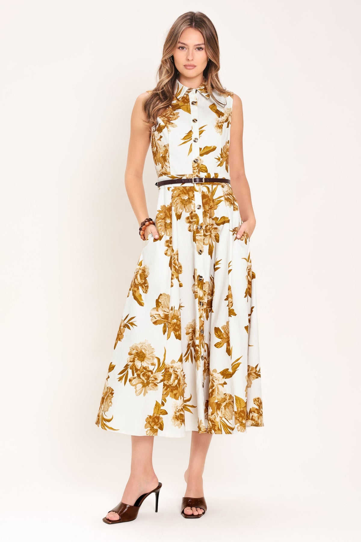 Woman wearing a floral dress on a white background