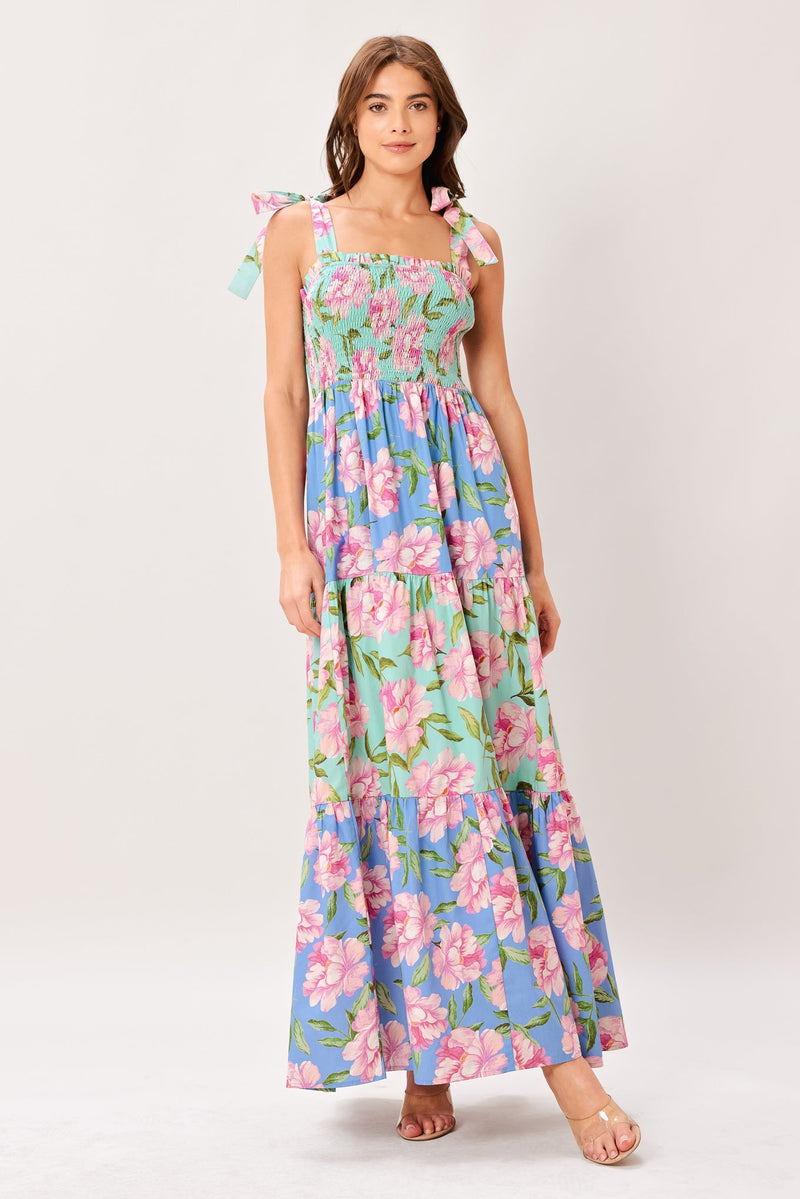 Woman wearing a floral dress on a white background