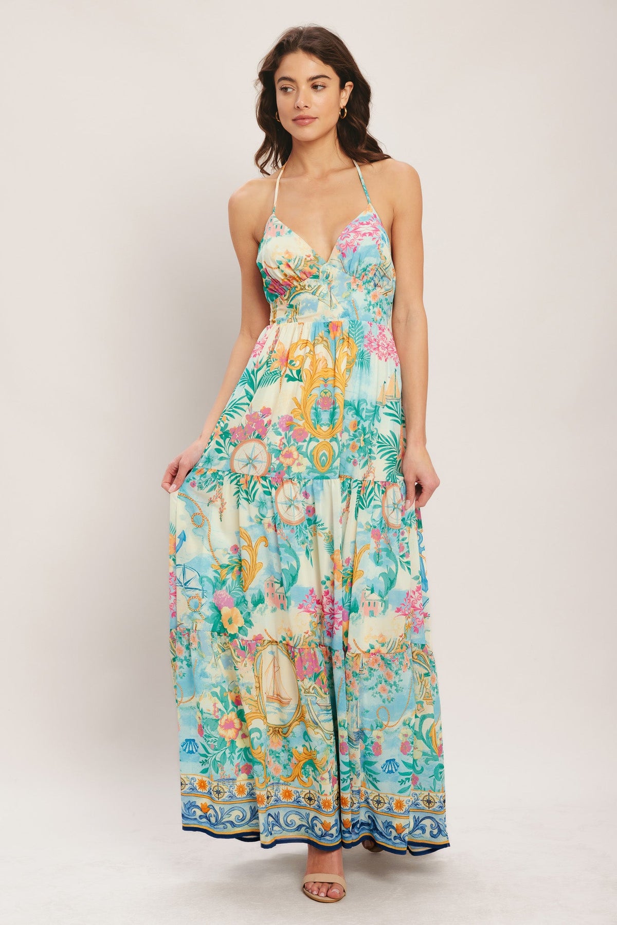Woman wearing a colorful floral dress on a white background