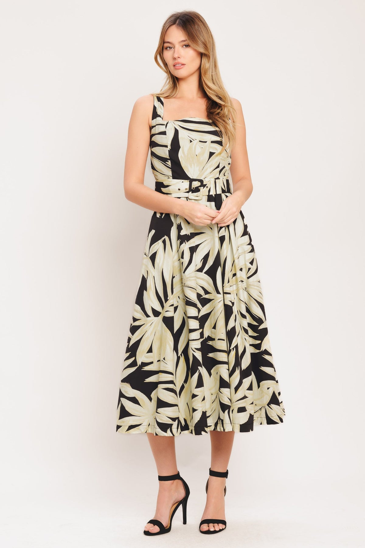 woman wearing leaf printed dress