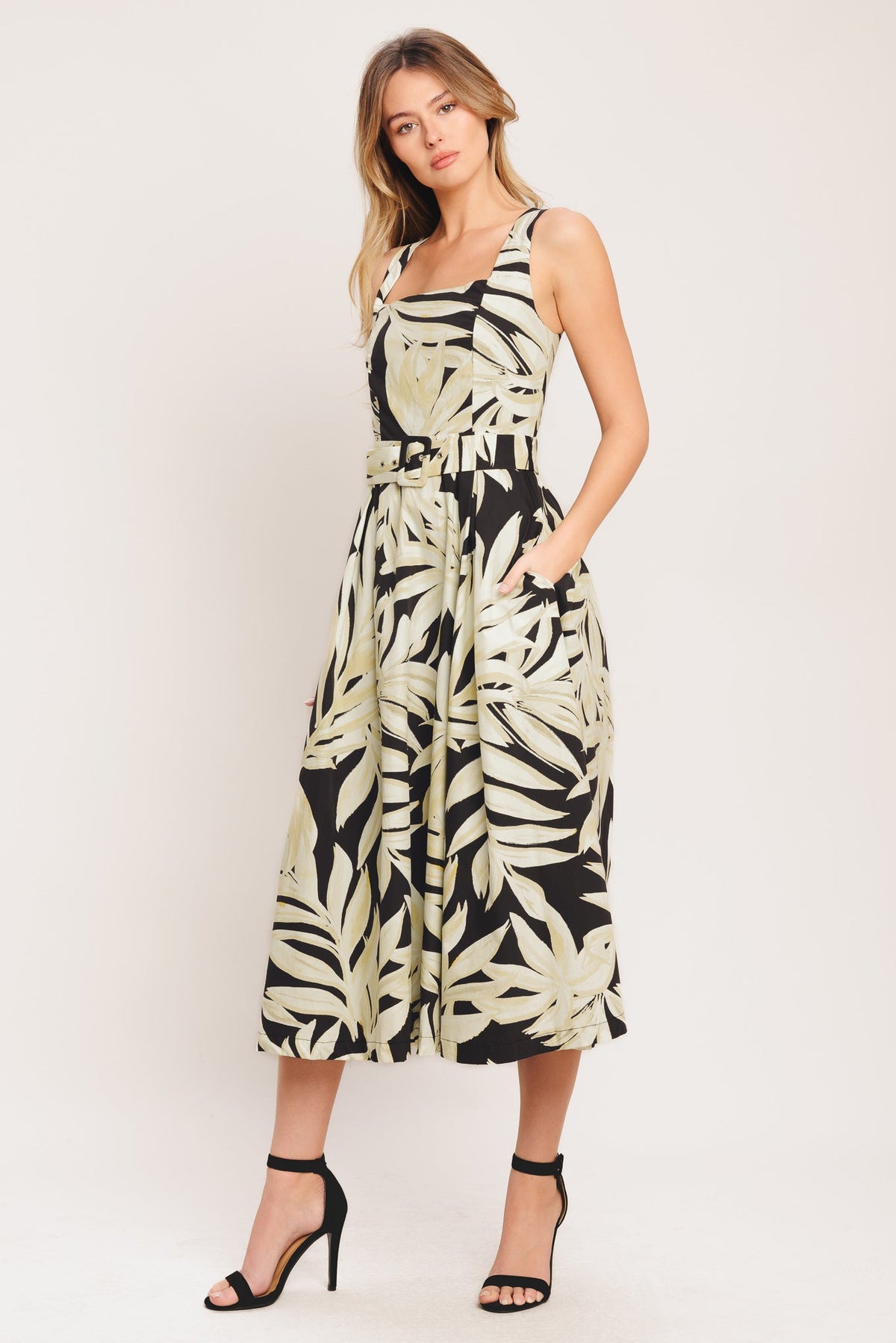 woman wearing leaf printed dress