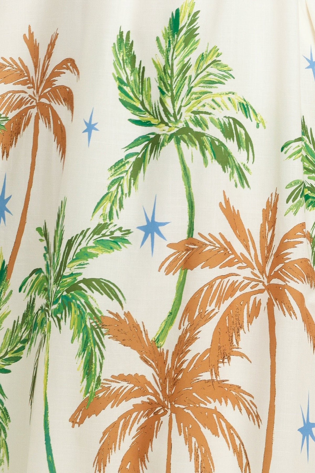 Fabric with palm tree and star pattern on a white background