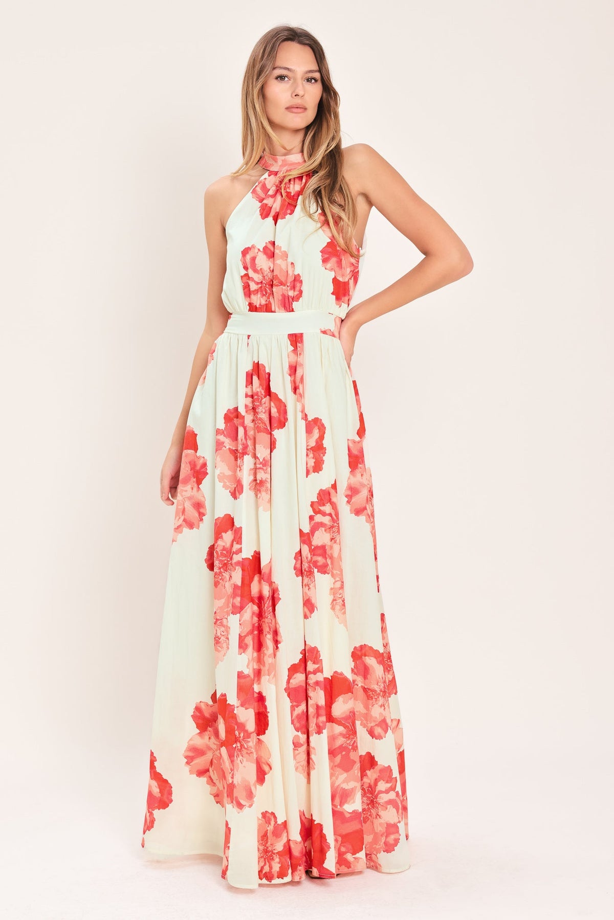 Woman wearing a floral dress with a plain background