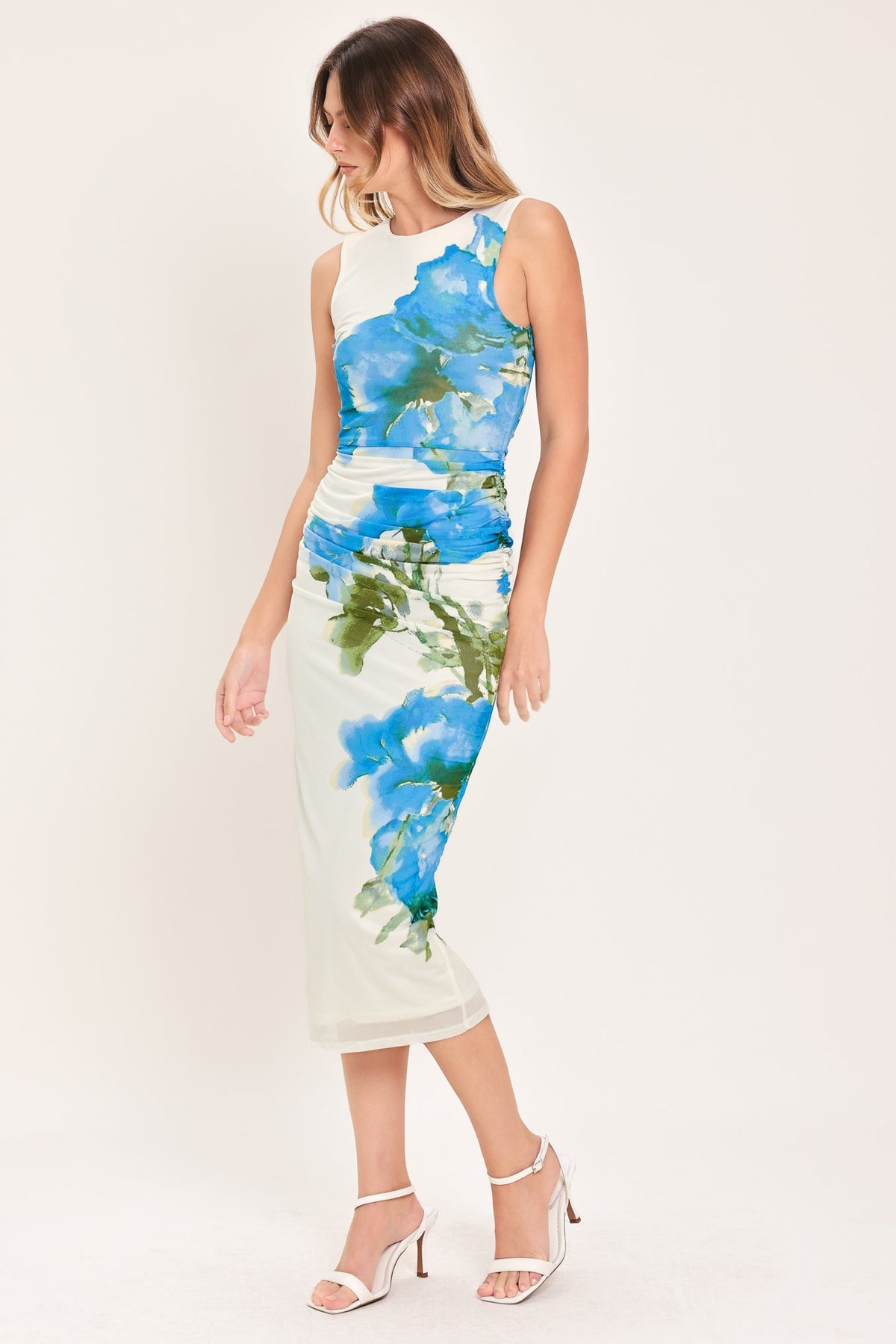 Woman wearing a floral dress with a white background