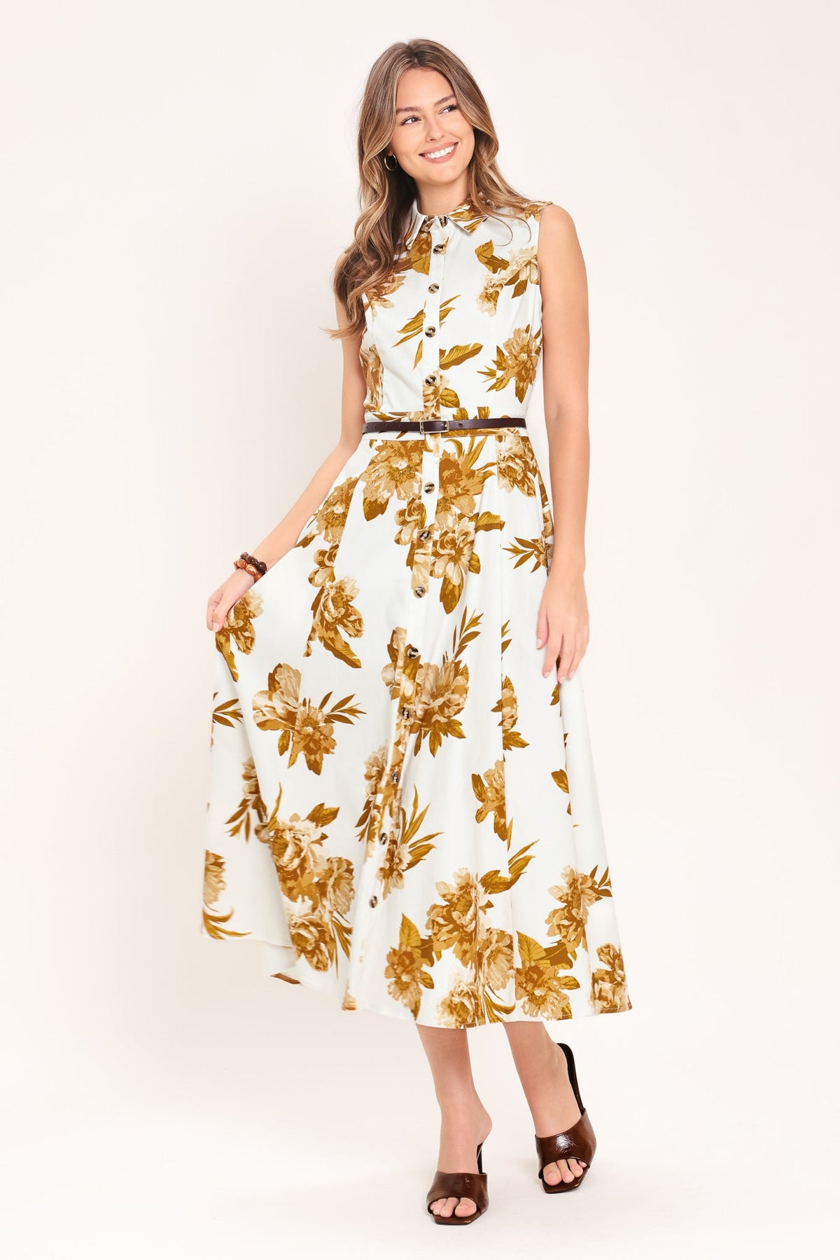 Woman wearing a floral dress with a white background