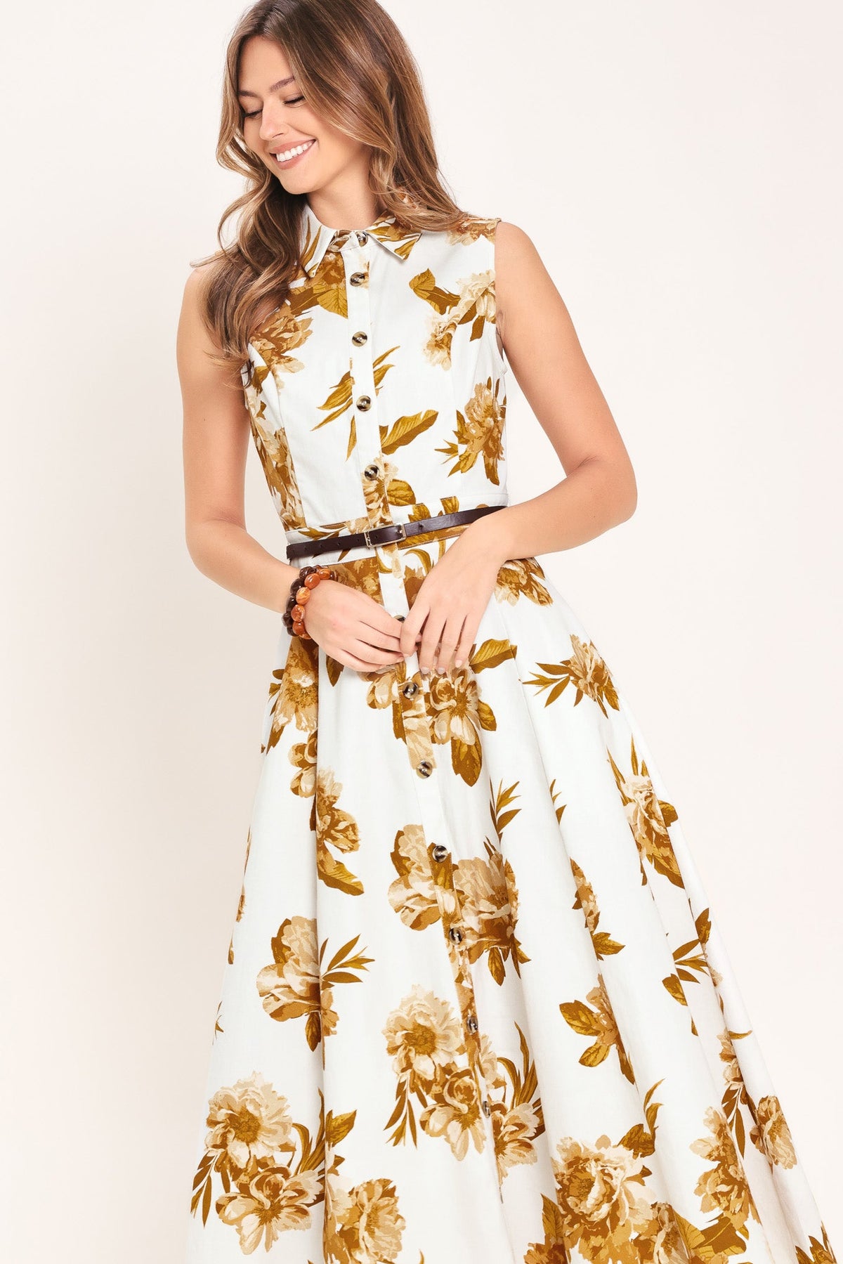 Woman wearing a floral dress with a white background