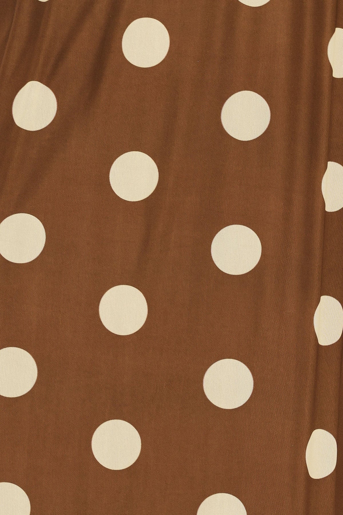 Brown fabric with white polka dots
