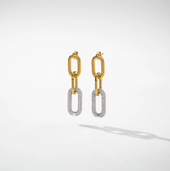 A pair of gold and silver drop earrings with a link chain design, featuring a polished gold top link and a pavé-set silver oval drop, shown on a clean white background with a soft shadow.