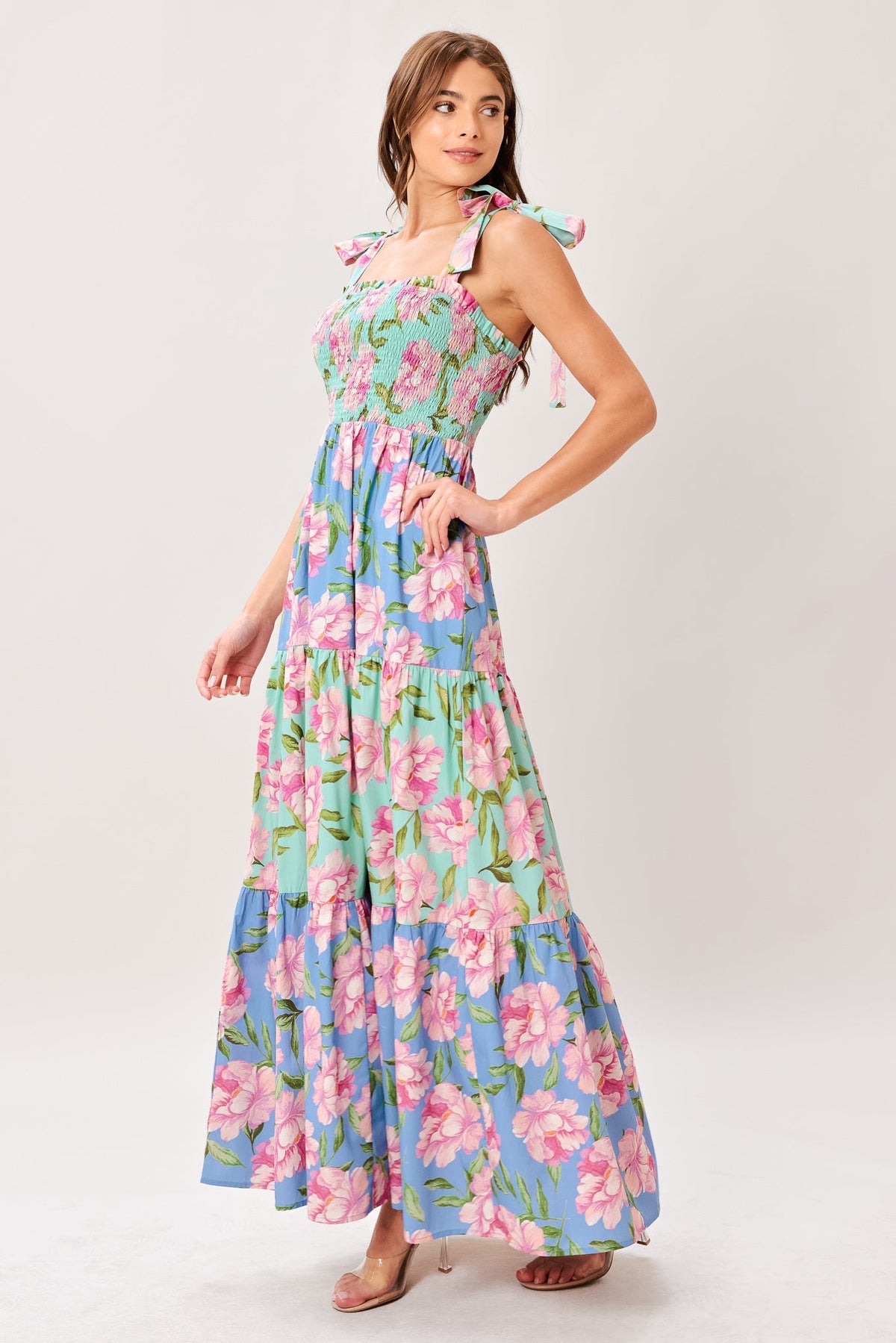 Woman wearing a floral dress on a white background