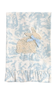 Baby blanket with bunny design on a blue floral pattern