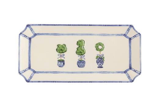 Decorative tray with blue and green floral designs on a white background