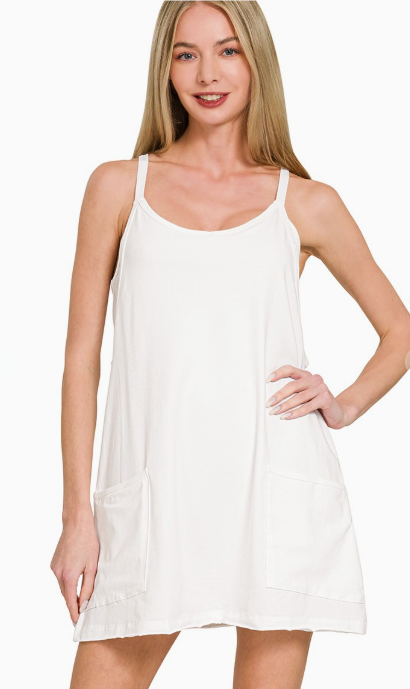 Woman wearing a white slip dress on a white background