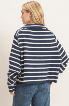 model wearing a striped navy and white cardigan