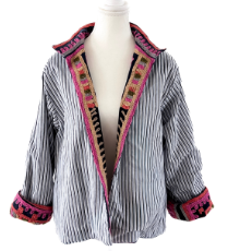 A women's long-sleeve striped shirt jacket with a wide collar and colorful patterned trim on the collar, front opening, and cuffs, displayed on a white mannequin torso against a white background.