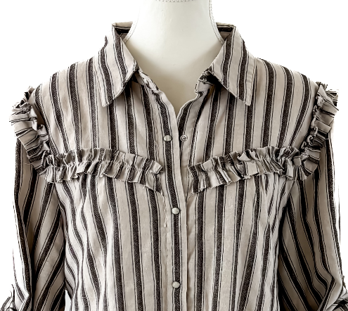 A striped long-sleeve blouse with ruffled shoulder details and ruffled chest pockets, displayed on a white mannequin torso against a white background.