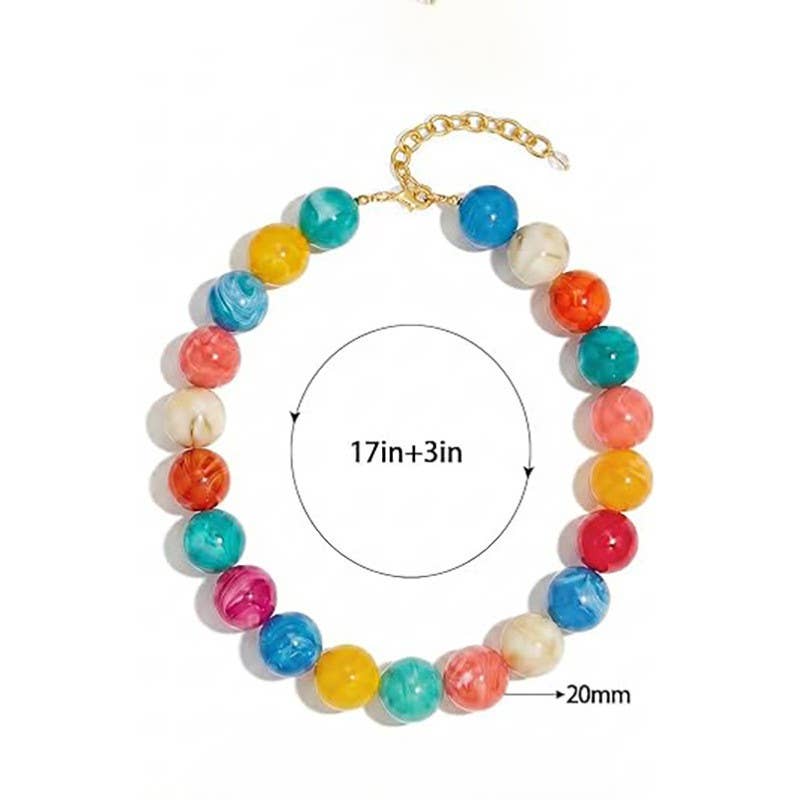 Colorful beaded bracelet with gold chain on a white background