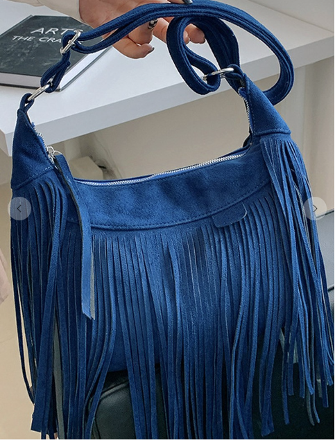 blue tasseled messenger bag