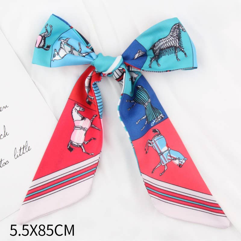 A silk scarf tied into a bow, featuring a colorful print of stylized horses in different poses on blocks of light blue, dark blue, coral red, and white. The text '5.