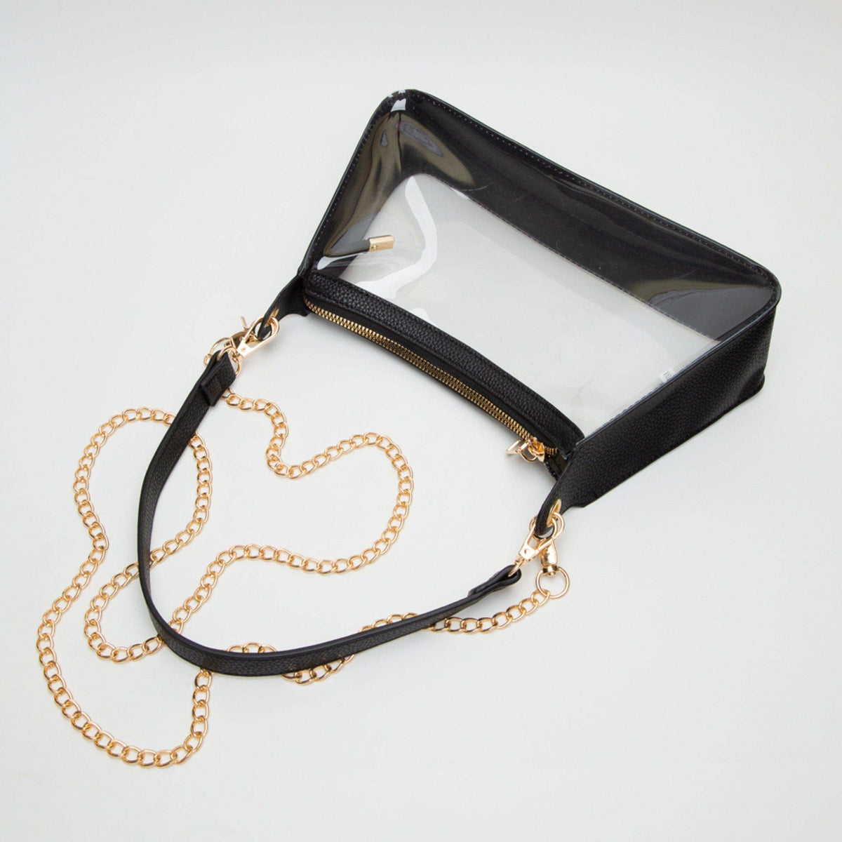 Black handbag with a gold chain strap on a white background
