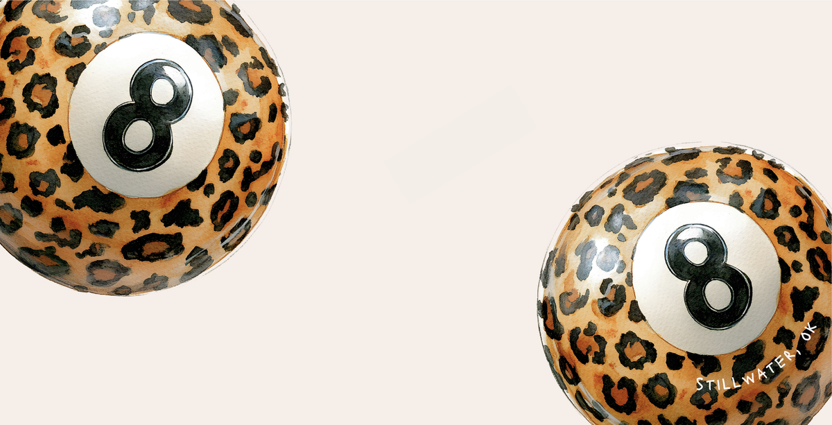 Two leopard print pool balls with number 8 on a beige background