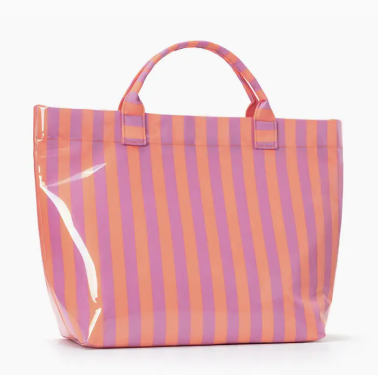 A glossy tote bag with vertical pink and orange stripes, featuring two top handles and a shiny patent finish, set against a plain white background.